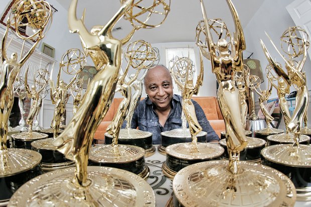 Jesse Vaughan displays the extensive collection of Emmys he has won through the years for various projects. His latest, won last Saturday, is for a documentary film on food deserts for Virginia State University, where he is director of the Advance Creative Services Group. 