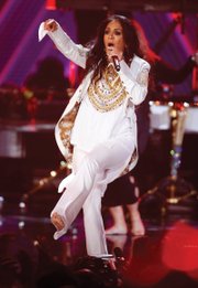 Sheila E. performs a medley of songs in her tribute to the late music icon Prince during the awards show.