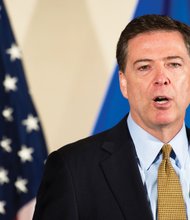 FBI Director James Comey takes no questions from reporters after issuing his statement Tuesday on the bureau’s yearlong probe into former Secretary of State Hillary Clinton’s private email server.