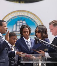 Norfolk’s new mayor //


Kenneth C. Alexander, a former state senator and member of the House of Delegates who previously served
as chairman of the Virginia Legislative Black Caucus, takes the oath of office as Norfolk’s new mayor during a ceremony last Friday outside Norfolk City Hall. Mr. Alexander’s May 3 election makes him the first African-American mayor of the Hampton Roads city. His wife, Donna Alexander, holds the Bible as he is sworn in by Judge John R. Doyle III, chief judge of Norfolk Circuit Court. The Alexanders were joined by their sons, David, left, and Kenneth II. Mayor Alexander is president of the family-owned Metropolitan Funeral Service.