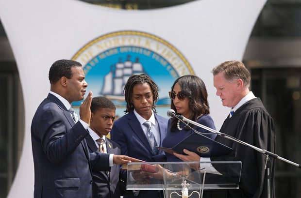 Norfolk’s new mayor //


Kenneth C. Alexander, a former state senator and member of the House of Delegates who previously served
as chairman of the Virginia Legislative Black Caucus, takes the oath of office as Norfolk’s new mayor during a ceremony last Friday outside Norfolk City Hall. Mr. Alexander’s May 3 election makes him the first African-American mayor of the Hampton Roads city. His wife, Donna Alexander, holds the Bible as he is sworn in by Judge John R. Doyle III, chief judge of Norfolk Circuit Court. The Alexanders were joined by their sons, David, left, and Kenneth II. Mayor Alexander is president of the family-owned Metropolitan Funeral Service.