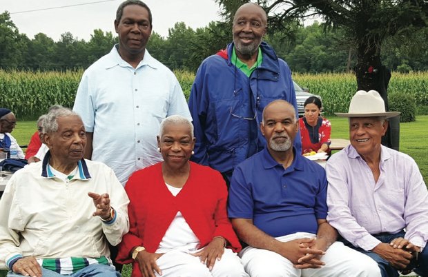 Senior Judge Damon J. Keith, seated left, of the 6th U.S. Circuit Court of Appeals in Detroit hosts his annual Independence Day picnic in Hanover County, where he honored Judge Roger Gregory, seated second from right, named the new chief judge of the 4th U.S. Circuit Court of Appeals in Richmond. With them, standing from left, are U.S. District Judge Raymond A. Jackson of Norfolk and Senior U.S. District Judge Sterling Johnson Jr. of New York, and, seated from left, Elaine Jones, former president and director-counsel of the NAACP Legal Defense Fund, and former Gov. L. Douglas Wilder.  