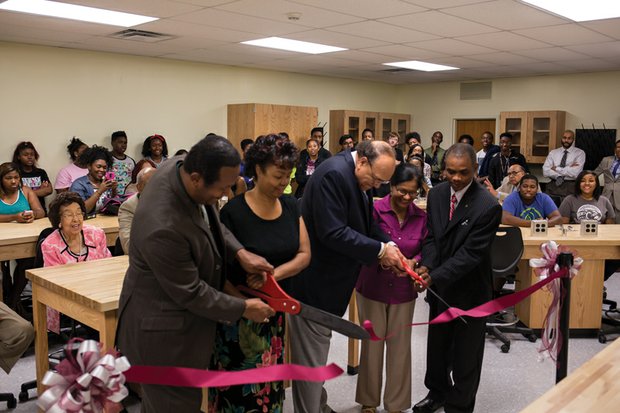 Virginia Union University President Dr. Claude G. Perkins, center, takes part in the recent ribbon-cutting ceremony at the new physics lab in Ellison Hall. He is joined by, from left, Dr. Gerard McShepard, chair of the Department of Natural Sciences; Dr. LaTrelle Green, dean of the School of Mathematics, Science and Technology; and Dr. Shaheen Islam and Dr. Francis Mensah, both of the Department of Natural Sciences. 