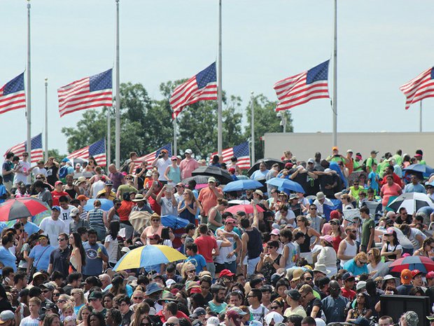 A multiethnic crowd gathers Saturday near the Washington Monument for “Together 2016,” an evangelical Christian prayer rally. The flags were at half-mast for the victims of the terrorist attack in Nice, France, on July 14.