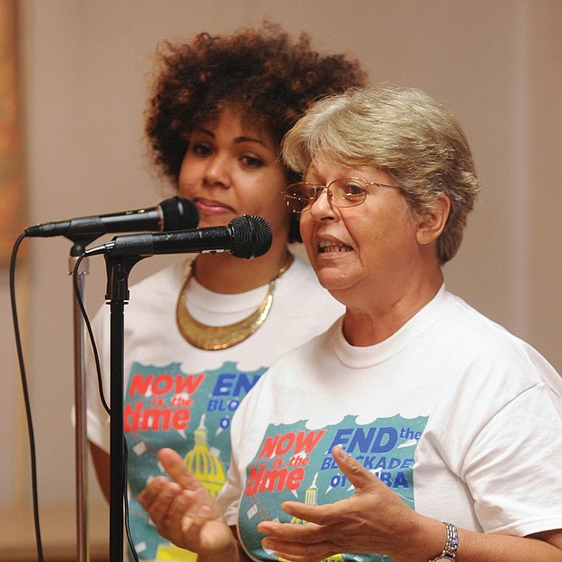 Linking with Cuba //
Gladys Abella, right, with the Martin Luther King Center in Havana, Cuba,
is assisted by translator Claudia De La Cruz of the IFCO/Pastors for Peace as she discusses life in Cuba under the U.S. trade and travel embargo. She spoke during a July 7 meeting at Wesley Memorial United Methodist Church in the East End that focused on links between Cuba and Africans. Her visit was organized by the African Awareness Association.