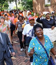 Sandra Sellars/Richmond Free Press
More than 100 people march to the Virginia Supreme Court building following Tuesday’s rally in Capitol Square supporting Gov. Terry McAuliffe’s order restoring voting rights to more than 200,000 felons.