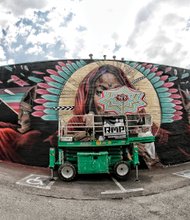 The project, spearheaded by a Washington art studio, has added more than 100 murals to building exteriors in the city since it began in 2012.