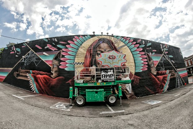 The project, spearheaded by a Washington art studio, has added more than 100 murals to building exteriors in the city since it began in 2012.