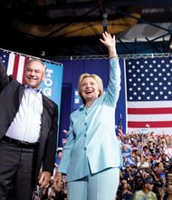 Democratic presidential candidate Hillary Clinton introduces her running mate, U.S. Sen. Tim Kaine of Virginia, during a rally Saturday at Florida International University Panther Arena in Miami.