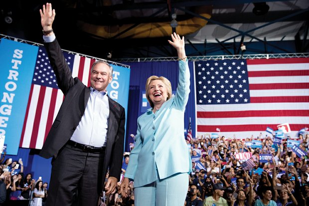 Democratic presidential candidate Hillary Clinton introduces her running mate, U.S. Sen. Tim Kaine of Virginia, during a rally Saturday at Florida International University Panther Arena in Miami.