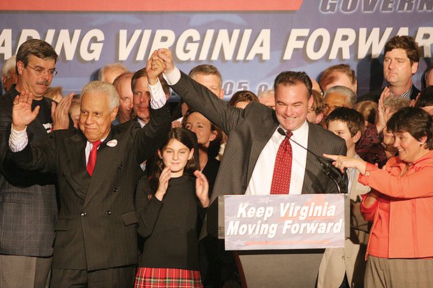 Gov.-elect Kaine signals his victory on election night 2005 with former Gov. L. Douglas Wilder. 