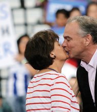 Sen. Kaine gives his wife, Anne Holton, a kiss in response to her glowing introduction at Monday’s rally.