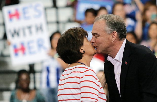 Sen. Kaine gives his wife, Anne Holton, a kiss in response to her glowing introduction at Monday’s rally.