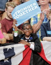 Young motivational speaker Elijah Coles Brown of Henrico County is among those cheering Sen. Kaine.  
