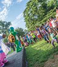 Crime-fighting power in community // Two-year-old Summer Sky, above right in green shirt, and 5-year-old Aiden Cox, in red, white and blue shirt, dance Tuesday evening at a National Night Out celebration in North Side,