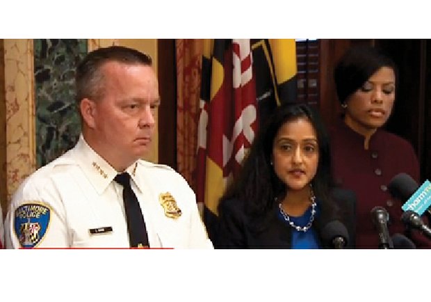 Vanita Gupta, center, head of the Civil Rights Division of the U.S. Department of Justice, announces findings Wednesday as Baltimore Police Commissioner Kevin Davis and Mayor Stephanie Rawlings-Blake listen. 