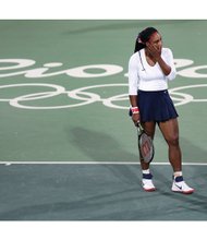 Venus Williams, right, confers with her sister, Serena, after losing a point in the first round doubles match Sunday against Lucie Safarova and Barbora Strycova of the Czech Republic at the Summer Olympics in Brazil.