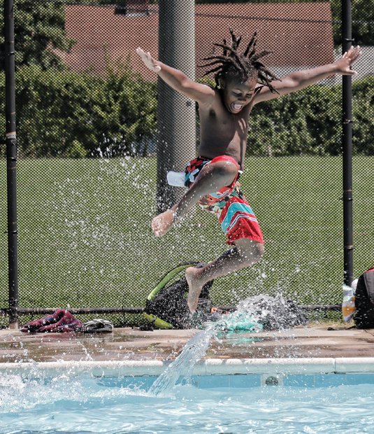 Beating the heat
Sweltering temperatures that reached nearly 100 degrees this week were enough to convince Donovan Walker to cool off by jumping into the Hotchkiss Pool at 701 E. Brookland Park Blvd. in North Side. Periods of heavy rain brought some brief relief, but it didn’t last long. Weather forecasters predict slightly lower temperatures over the next few days. Highs are expected in the mid- to upper 80s with scattered thunderstorms.