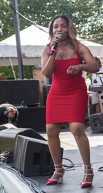 Hot summer jazz // Longtime singer Stephanie Mills, right, performed on three stages throughout both days. A portion of the proceeds from the festival will benefit the Richmond Public Schools Education Foundation, the Richmond Jazz Society and the Maymont Foundation.