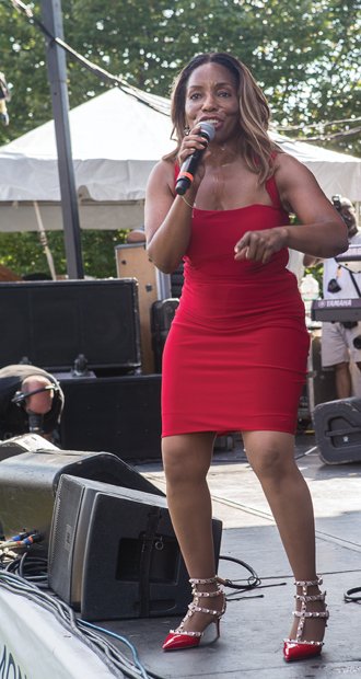 Hot summer jazz // Longtime singer Stephanie Mills, right, performed on three stages throughout both days. A portion of the proceeds from the festival will benefit the Richmond Public Schools Education Foundation, the Richmond Jazz Society and the Maymont Foundation.