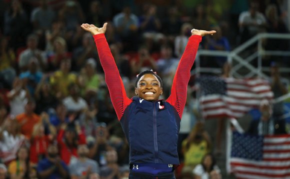 Simone Biles showed off her sassy moves and explosive tumbles on the floor exercise to win a record-equaling fourth gold ...
