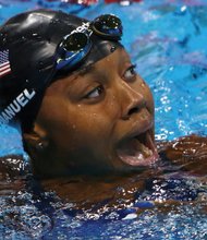 
Simone Manuel reacts with surprise last Thursday after winning the gold in the 100-meter freestyle competition and setting a new Olympic record.