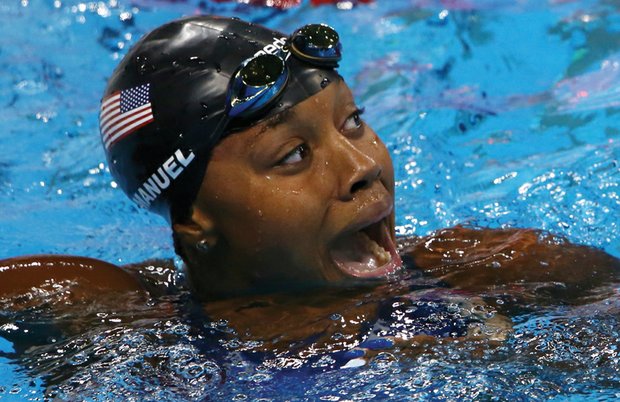 
Simone Manuel reacts with surprise last Thursday after winning the gold in the 100-meter freestyle competition and setting a new Olympic record.