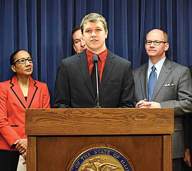 From Left to Right; State Senator Jacqueline Collins, Trevor Gervais (behind Gervais; State Senator Andy Manar) and State Senator Don Harmon. The group announced their support of the Automatic Voter Registration bill during a January press conference in the state capitol building. Photo courtesy of Kevin Hahn- Illinois Senate Democratic Caucus.