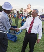 Family, folklore and food were highlighted last Saturday at the
26th Annual Down Home Family Reunion organized by the Elegba
Folklore Society.
Festivalgoers enjoyed performances by musical groups, including
headliners The Intruders, and browsed tables in the cultural
marketplace filled with wares and information linking West African
and African-American history and traditions.
Left, Congressman Robert C. “Bobby” Scott, who represents the
3rd District that formerly included Richmond, pauses to talk with
a festivalgoer.