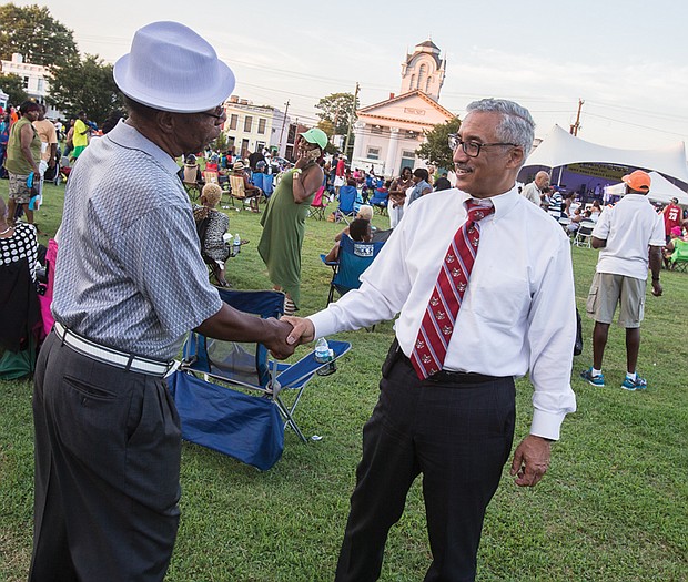 Family, folklore and food were highlighted last Saturday at the
26th Annual Down Home Family Reunion organized by the Elegba
Folklore Society.
Festivalgoers enjoyed performances by musical groups, including
headliners The Intruders, and browsed tables in the cultural
marketplace filled with wares and information linking West African
and African-American history and traditions.
Left, Congressman Robert C. “Bobby” Scott, who represents the
3rd District that formerly included Richmond, pauses to talk with
a festivalgoer.