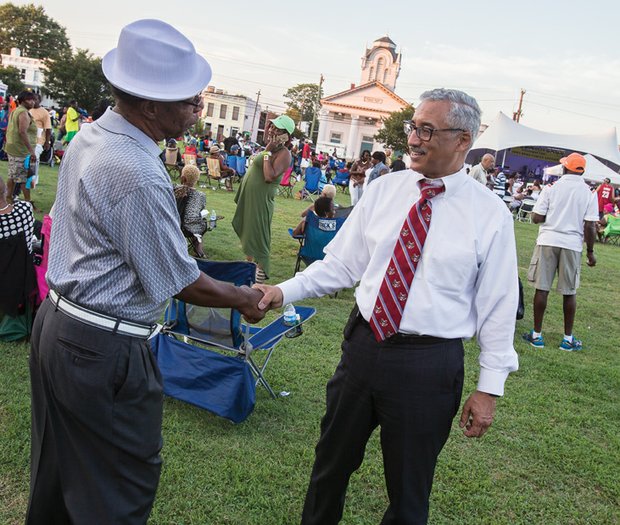 Family, folklore and food were highlighted last Saturday at the
26th Annual Down Home Family Reunion organized by the Elegba
Folklore Society.
Festivalgoers enjoyed performances by musical groups, including
headliners The Intruders, and browsed tables in the cultural
marketplace filled with wares and information linking West African
and African-American history and traditions.
Left, Congressman Robert C. “Bobby” Scott, who represents the
3rd District that formerly included Richmond, pauses to talk with
a festivalgoer.