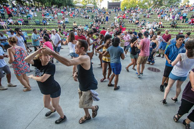 Moving to the beat // The event, one of the summer highlights
of the 60th Festival of the Arts,
drew crowds of people who enjoyed
the sounds of several musical groups.
Rather than sitting and tapping their feet,
many people jumped up and danced to
the rhythms.