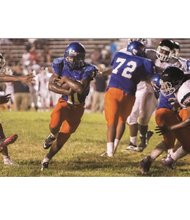 Armstrong High School quarterback Jacqueal Thomas, No. 11, takes the ball in for the Wildcats’ sole touchdown of the game last Friday against the George Wythe Bulldogs.