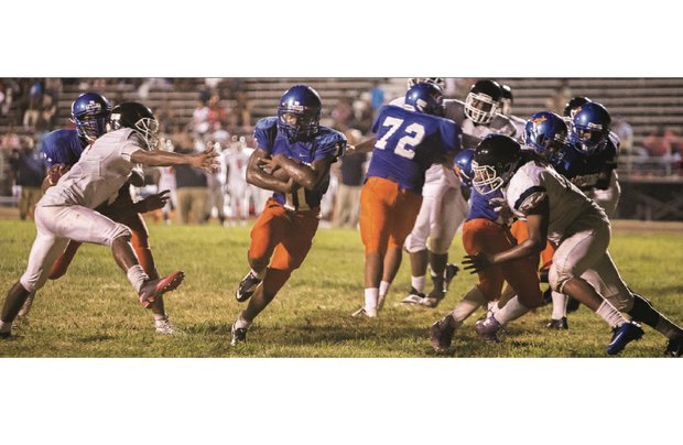 Armstrong High School quarterback Jacqueal Thomas, No. 11, takes the ball in for the Wildcats’ sole touchdown of the game last Friday against the George Wythe Bulldogs.