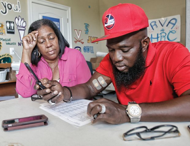 Freeway Stops for Calls //Hip-hop artist Freeway, best known for his work with Roc-A-Fella Records and East Coast rappers such as Jay-Z, makes a stop at the Richmond headquarters of the Clinton-Kaine campaign Tuesday to thank volunteers and supporters. Working with Stephenine Dixon, a Church Hill organizer, Freeway placed calls to supporters urging them to vote in the presidential election Nov. 8. He is one of the latest celebrities to stop by the headquarters in Scott’s Addition to lend his support to the campaign.
