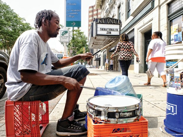 Rakeem Bruce delivers his signature beats in Downtown. He’s among the group of street musicians dubbed the Bucket Heads who perform original rhythms on traditional and nontraditional percussion instruments in hopes of receiving donations from passers-by. He was playing last Friday in the 700 block of East Broad Street.