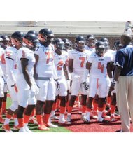 Virginia State University Coach Reggie Barlow addresses the team before last Saturday’s game against Lenoir-
Rhyne University in Hickory, N.C.