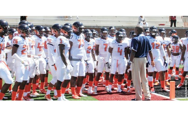 Virginia State University Coach Reggie Barlow addresses the team before last Saturday’s game against Lenoir-
Rhyne University in Hickory, N.C.