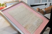 Mrs. Baskerville holds the deed to her family’s Buckingham County property. The deed is one of many family heirlooms featured in the Designer House.