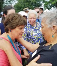 Anne Holton, left, and Free Press President-Publisher Jean P. Boone greet one another and pause to talk at the annual Labor Day Cookout.