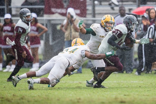 Virginia Union University wide receiver Lavatiae Kelly tries to avoid a takedown by Long Island University-Post’s defensive players during last Saturday’s season opener at Hovey Field. The VUU Panthers lost the matchup 14-12.