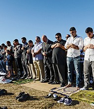 People participate in a group prayer session Monday in Brooklyn, N.Y., for the Muslim holiday Eid al-Adha.