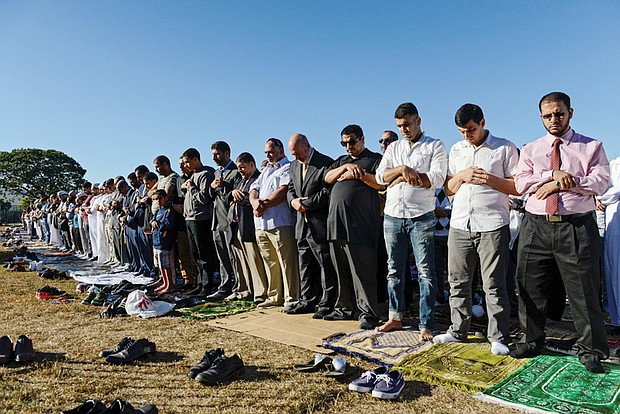 People participate in a group prayer session Monday in Brooklyn, N.Y., for the Muslim holiday Eid al-Adha.