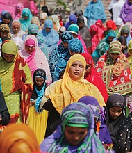 Women offer prayers for Eid al-Adha on Monday at a mosque in Ahmadabad, India. Muslims worldwide are celebrating the holiday, also known as the “Feast of Sacrifice” commemorating the willingness of the prophet Ibrahim to sacrifice his son for God.