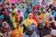 Women offer prayers for Eid al-Adha on Monday at a mosque in Ahmadabad, India. Muslims worldwide are celebrating the holiday, also known as the “Feast of Sacrifice” commemorating the willingness of the prophet Ibrahim to sacrifice his son for God.