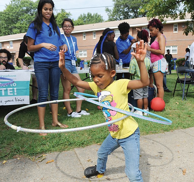 All the right moves

Mamaya Hart, 6, works two hula hoops at the Mosby Court Appreciation Day last Saturday at the East End public housing community. Residents of all ages enjoyed games, food, music, health screenings and other community resources available, including voter registration. The deadline to register to vote in the Nov. 8 election is Monday, Oct. 17.