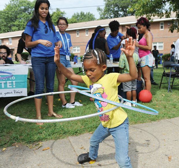 All the right moves

Mamaya Hart, 6, works two hula hoops at the Mosby Court Appreciation Day last Saturday at the East End public housing community. Residents of all ages enjoyed games, food, music, health screenings and other community resources available, including voter registration. The deadline to register to vote in the Nov. 8 election is Monday, Oct. 17.