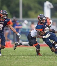 Defensive players rush in to tackle Virginia State University junior Trenton Cannon, part of the Trojans’ relentless overland offense that resulted in a VSU 24-10 victory last Saturday over Tusculum College.
