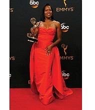 
Regina King poses backstage with her Emmy Award for outstanding supporting actress in a limited series or movie for her role in “American Crime.”