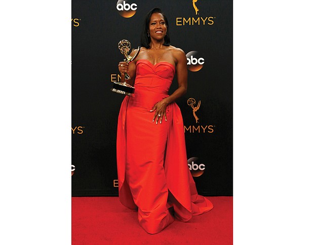 
Regina King poses backstage with her Emmy Award for outstanding supporting actress in a limited series or movie for her role in “American Crime.”